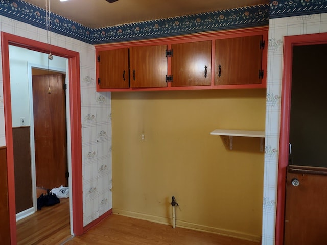 laundry room featuring light hardwood / wood-style floors