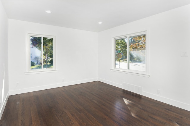 spare room with hardwood / wood-style flooring