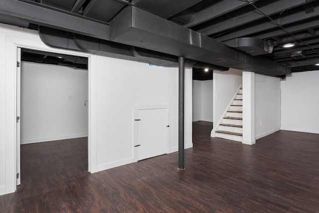 basement with dark wood-type flooring