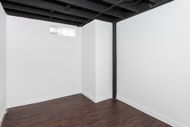 basement featuring dark hardwood / wood-style flooring