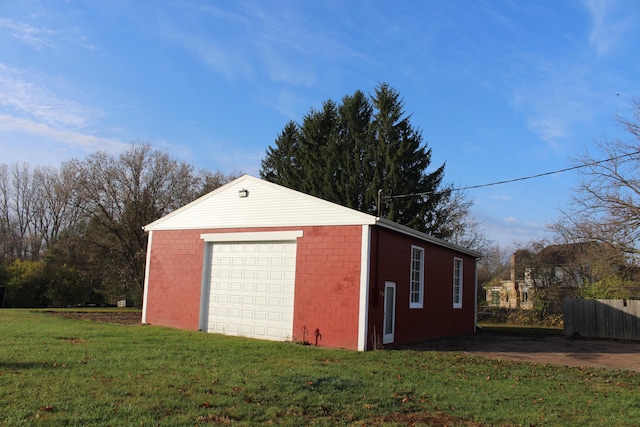 garage featuring a lawn