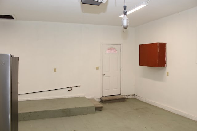 garage featuring stainless steel fridge