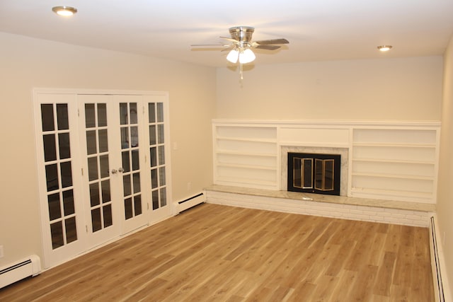 unfurnished living room with a fireplace, hardwood / wood-style flooring, ceiling fan, and a baseboard heating unit