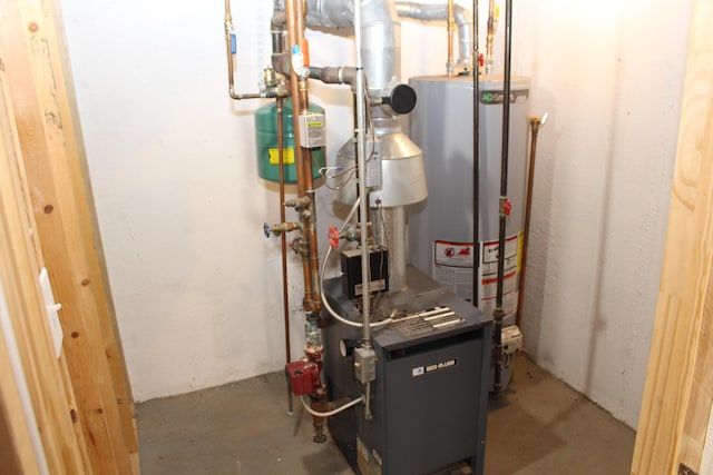 utility room featuring gas water heater