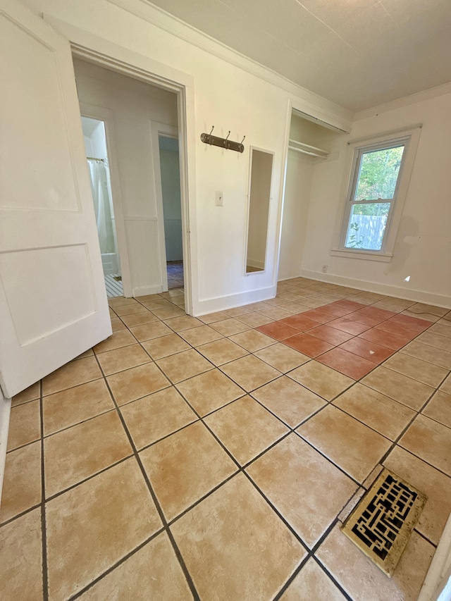 interior space with a closet and light tile patterned floors