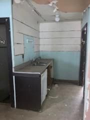 kitchen featuring white cabinets and sink