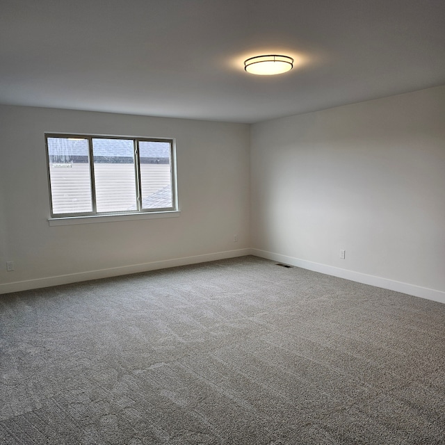 empty room featuring carpet floors