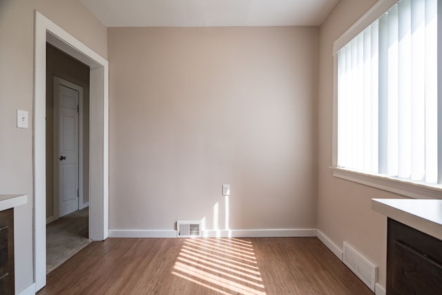 unfurnished room featuring hardwood / wood-style floors