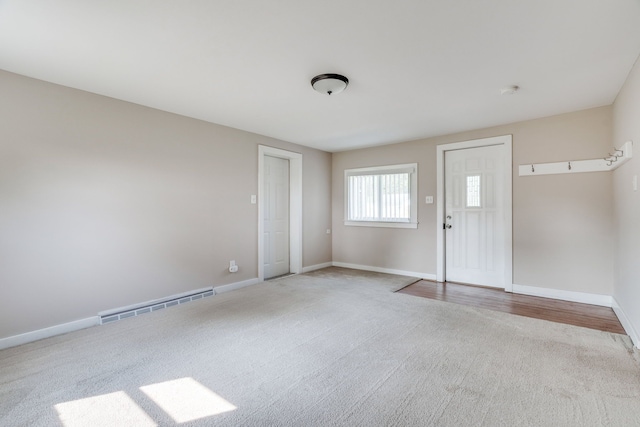 empty room with light hardwood / wood-style floors