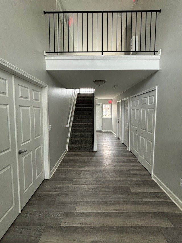 hallway with dark wood-type flooring