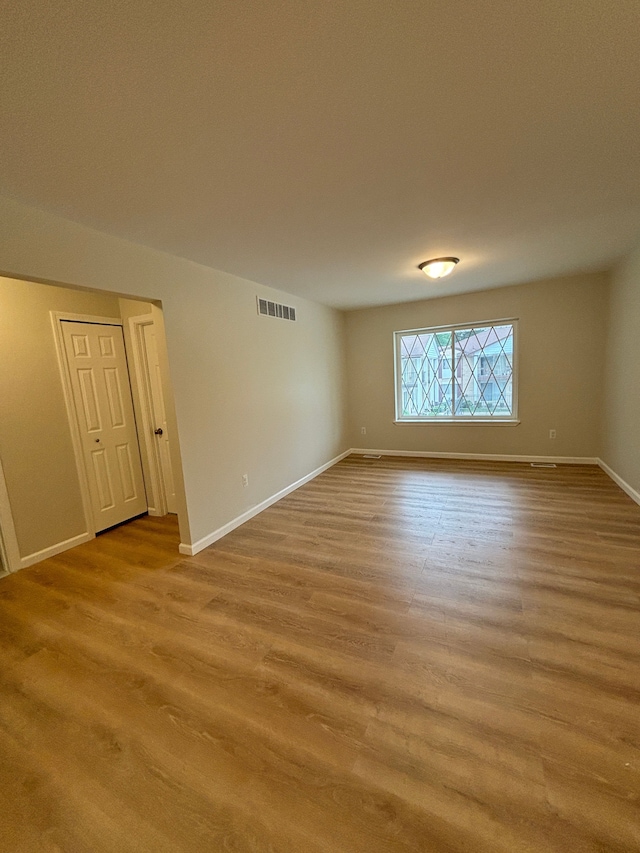 unfurnished room featuring light wood-type flooring