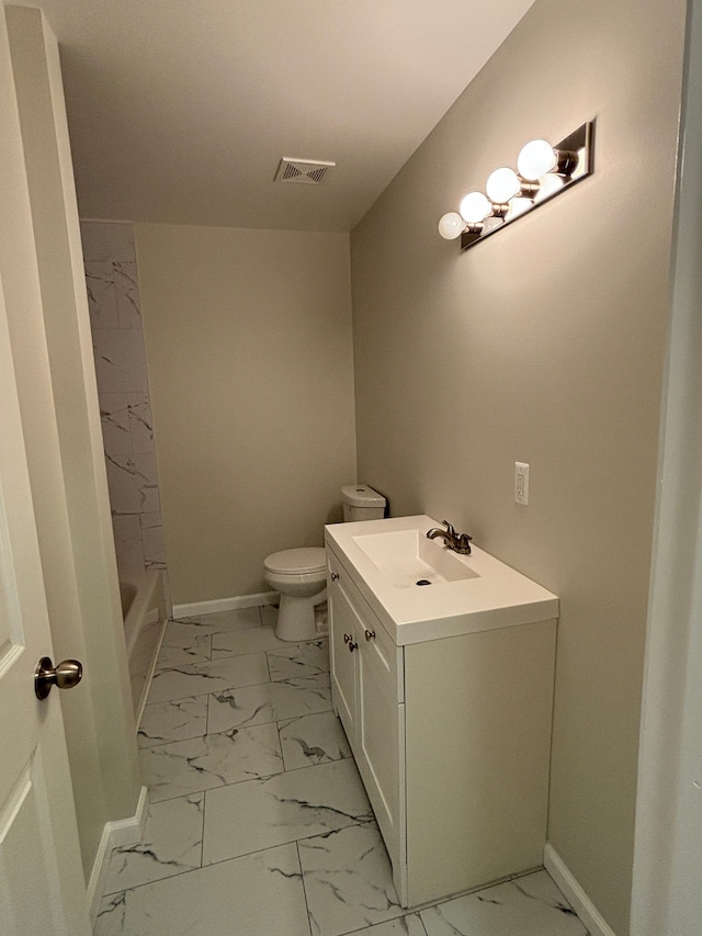 bathroom with vanity and toilet