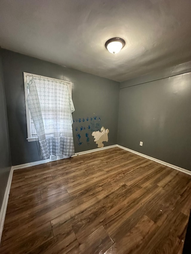 spare room featuring hardwood / wood-style flooring