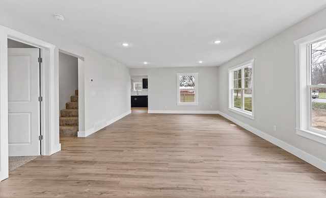 unfurnished living room with light hardwood / wood-style floors