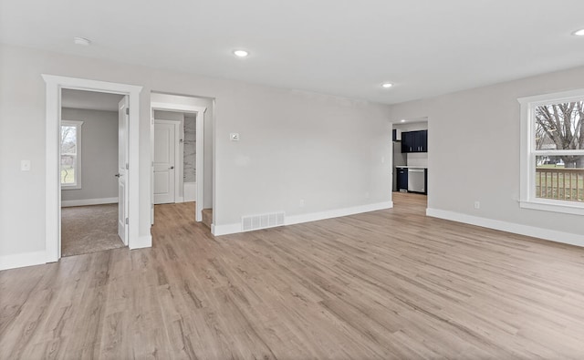 unfurnished living room with light hardwood / wood-style flooring