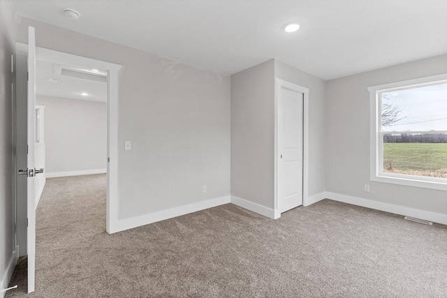 empty room with carpet flooring