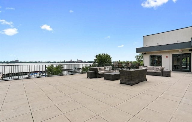 view of patio / terrace featuring a water view and an outdoor hangout area