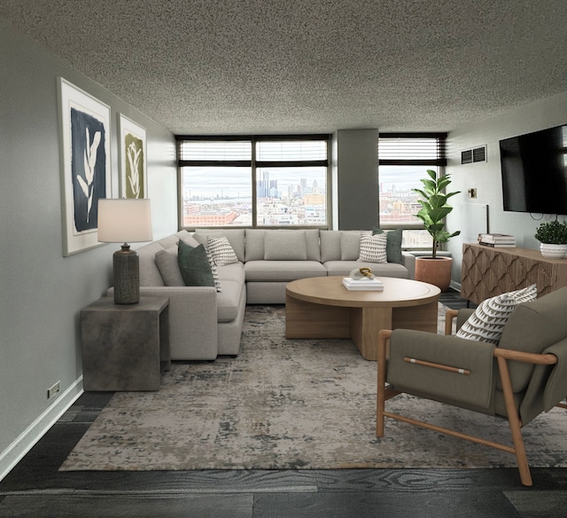 living room featuring a textured ceiling and a wall of windows