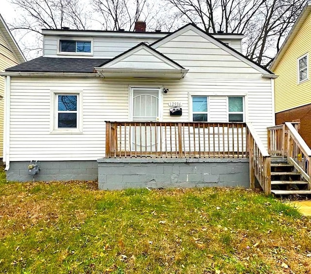 rear view of house with a lawn