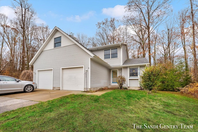 view of front property with a garage and a front lawn