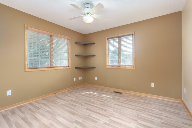 unfurnished room featuring ceiling fan and light wood-type flooring