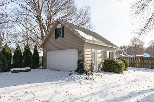 exterior space featuring an outbuilding and a garage