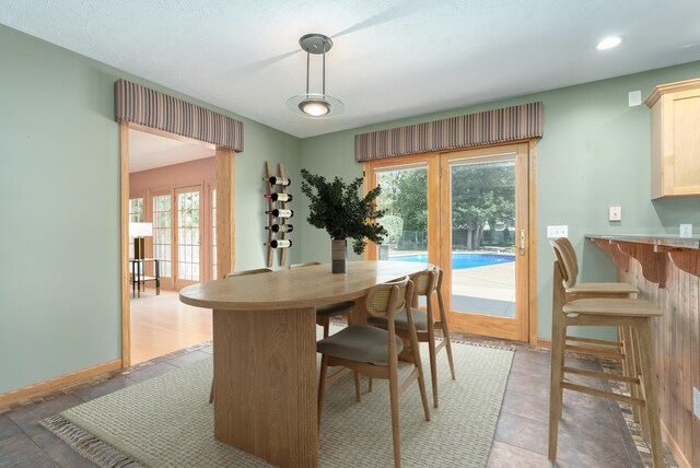 dining area with light tile patterned floors