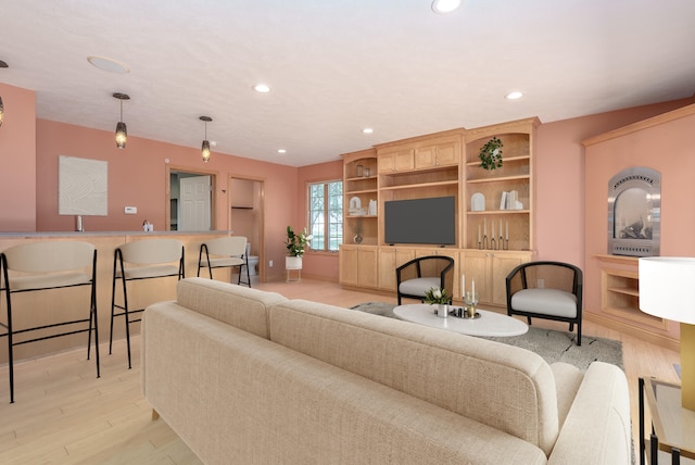 living room with light hardwood / wood-style flooring