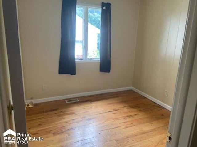 unfurnished room featuring light hardwood / wood-style floors