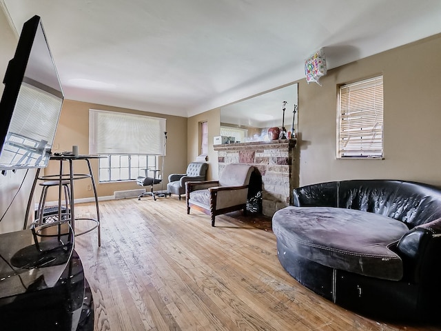 living room with light hardwood / wood-style flooring