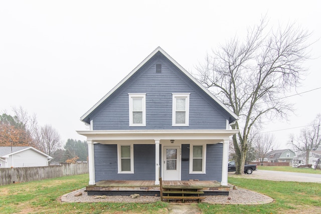 bungalow featuring a front lawn and covered porch