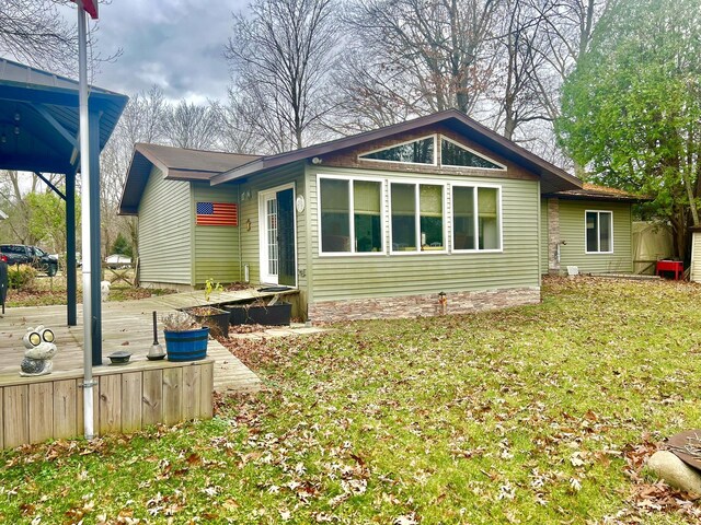 5376 Circle Dr, Reading, MI 49274 - view of front of property with a wooden deck and a front yard