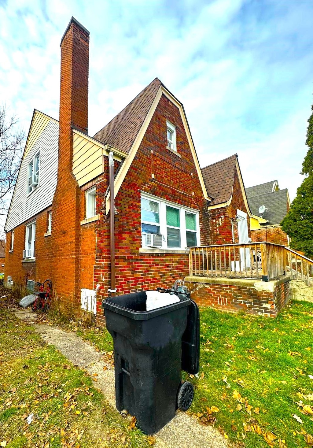 rear view of house with a lawn