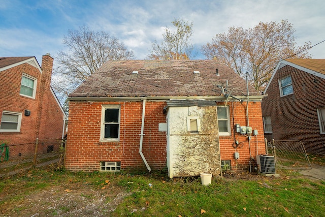 rear view of property featuring cooling unit