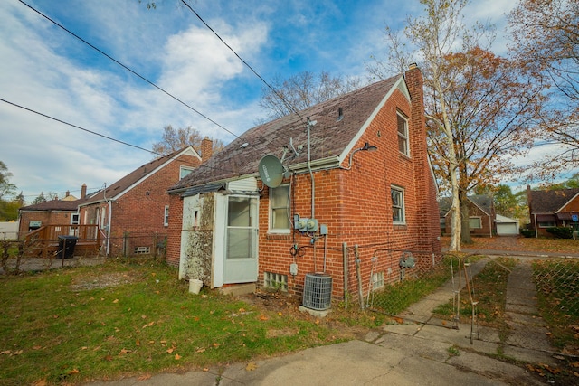 view of property exterior with a lawn