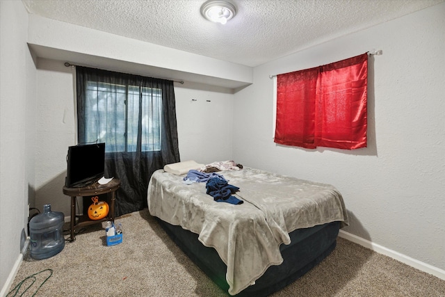 carpeted bedroom with a textured ceiling