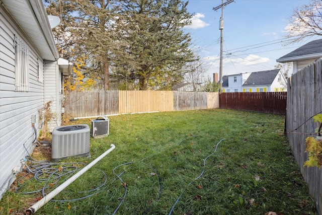 view of yard with central AC