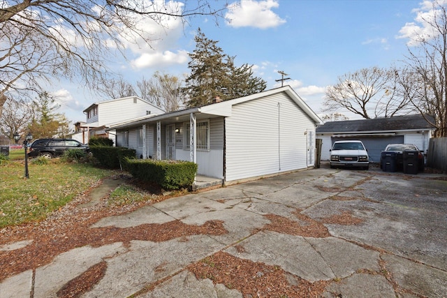 view of side of property with covered porch