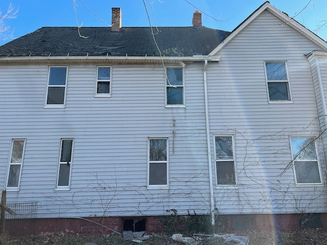 2932 Elmwood St, Detroit, MI 48207 - view of side of property featuring a chimney