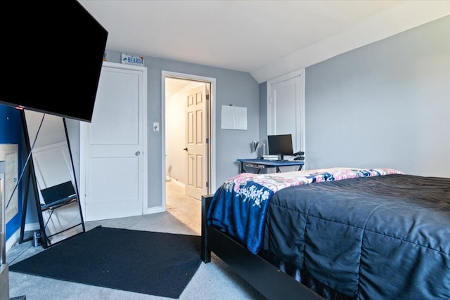 bedroom featuring light carpet