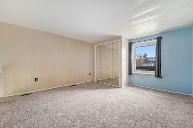 unfurnished bedroom featuring carpet