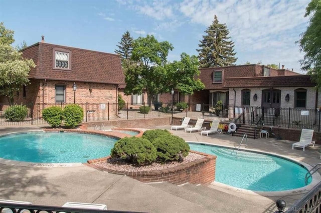 view of swimming pool featuring a patio