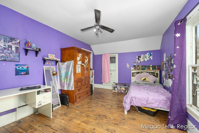 bedroom with hardwood / wood-style floors, ceiling fan, and lofted ceiling