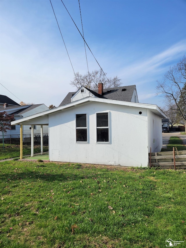 view of home's exterior featuring a yard