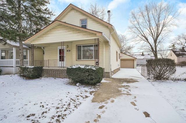 bungalow-style house with an outbuilding and a garage