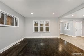 5200 Haverhill St, Detroit, MI 48224 - unfurnished living room featuring baseboards, wood finished floors, and recessed lighting