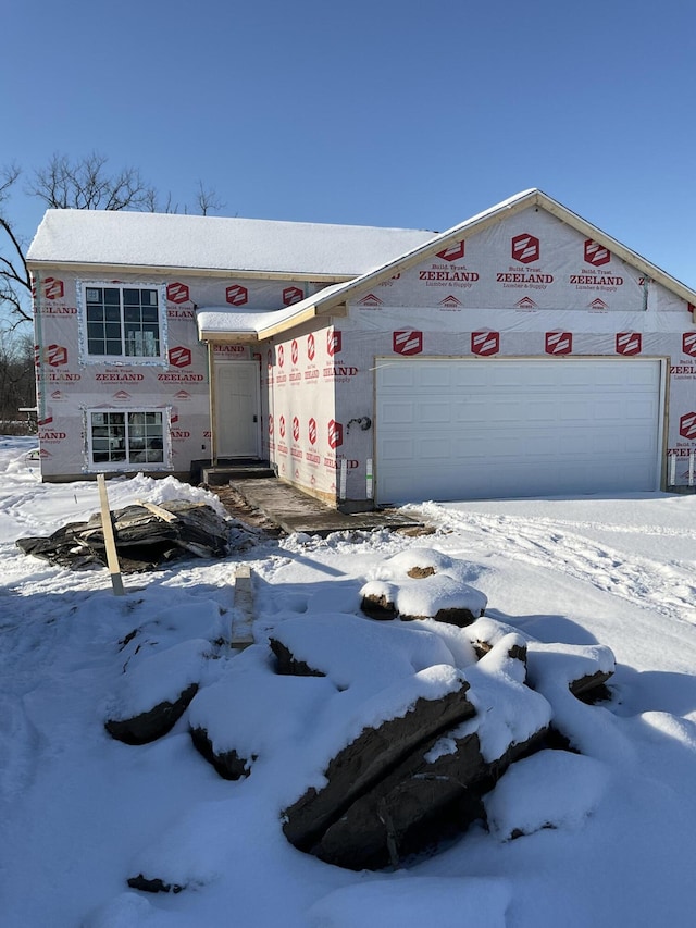 unfinished property featuring a garage