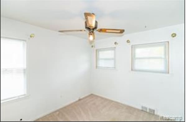 spare room featuring ceiling fan