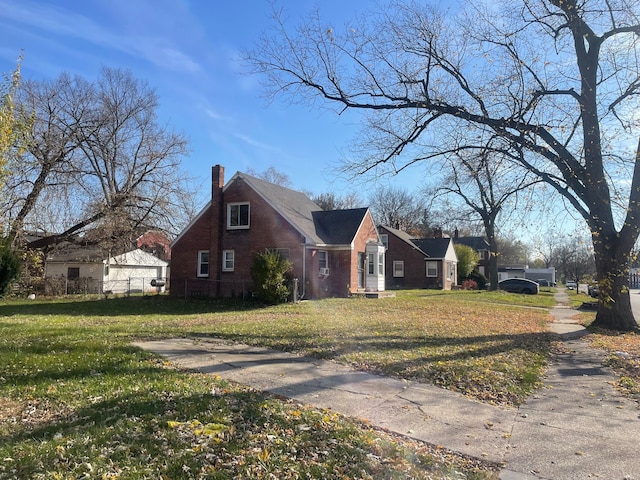 15340 Stout St, Detroit, MI 48223 - view of home's exterior with brick siding and a chimney