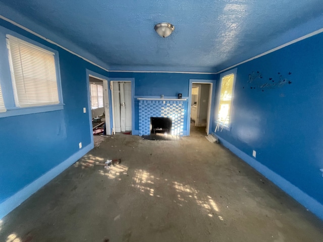 unfurnished living room featuring a textured ceiling